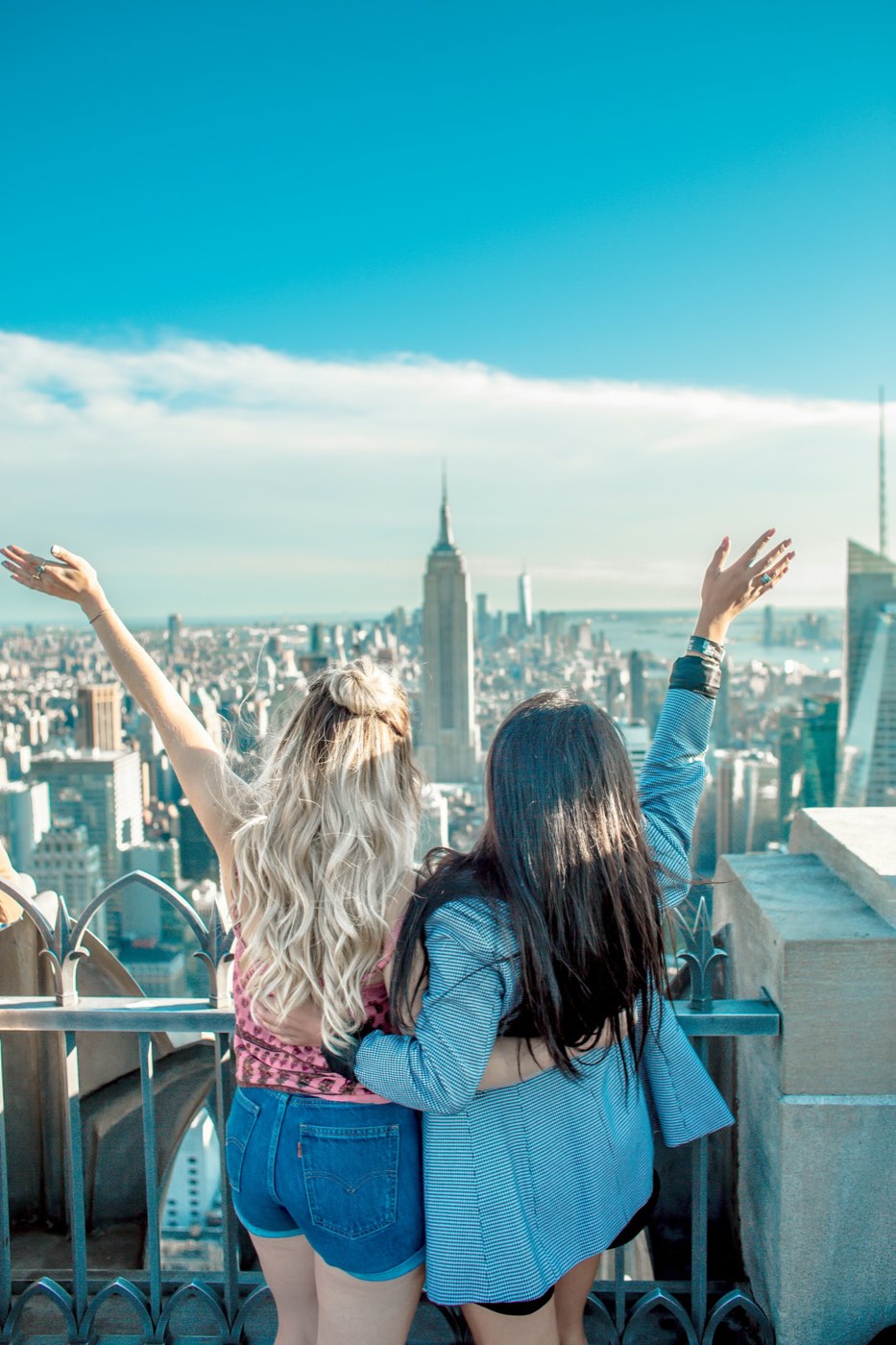 Cheering at a rooftop view of the Empire State Building